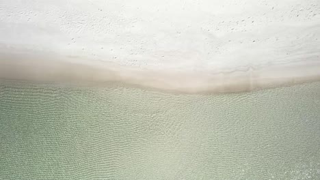 Rippling-Water-In-The-Shoreline-Of-Empty-Beach-In-Summer
