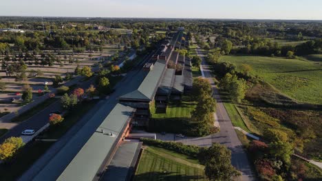 Massive-farm-buildings-in-Michigan,-aerial-drone-view-on-sunny-day