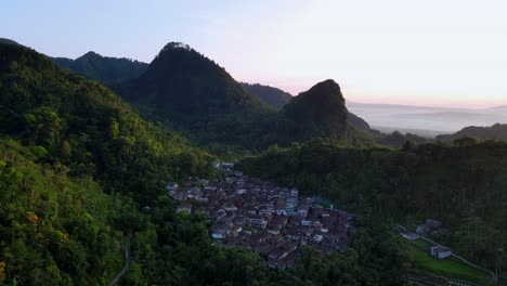 Aerial-view-of-Small-village-on-the-tropical-forest-and-hill-in-the-morning-summer
