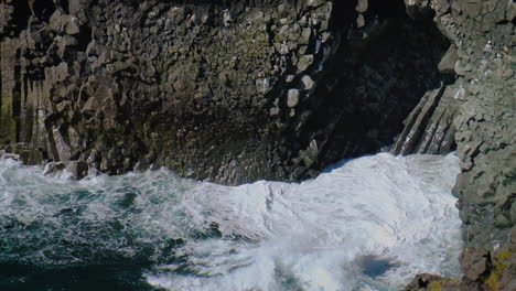Slow-motion-footage-of-sea-waves-on-coast-line-with-cliffs-and-rocks-in-Arnarstapi-village-in-Iceland-on-Snaefellsnes-peninsula
