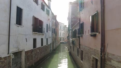 Empty-River-Canal-Lined-With-Old-Buildings-In-Venice,-Italy