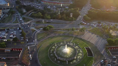 4K-Top-view-of-the-Plaza-Venezuela-fountain,-as-well-as-part-of-the-Francisco-Fajardo-highway-on-an-afternoon-in-Caracas,-Venezuela