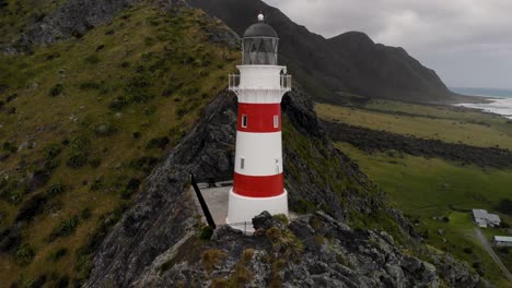 Iconic-red-and-white-striped-lighthouse-aerial-look-up