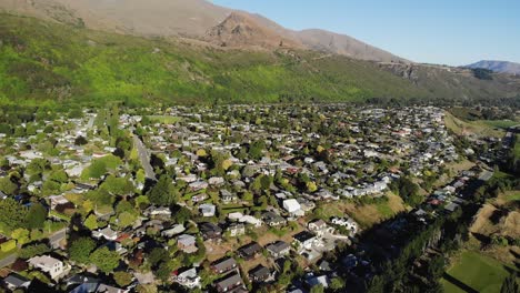 Aerial-orbit-reveal-of-urban-landscape,-small-town-in-New-Zealand