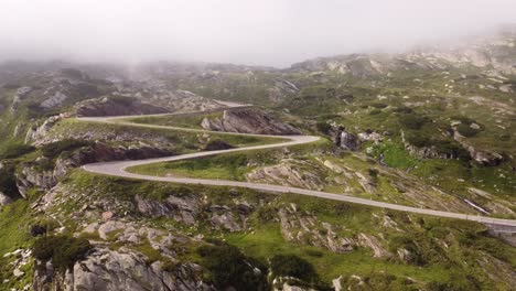 4K-drone-footage-captures-Swiss-Alps'-natural-beauty-as-the-sun-sets-through-clouds-at-Gotthard-Pass