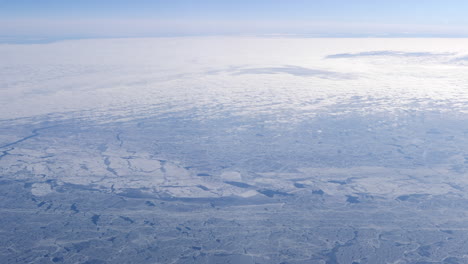 Frozen-Arctic-Sea-Seen-From-the-Flying-Airplane,-Sunny-Day