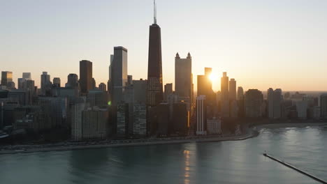 Sunset-between-skyscrapers-in-Streeterville,-downtown-Chicago,-USA---Aerial-view