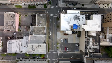 Overhead-drone-view-of-intersection-in-downtown-Mobile,-Alabama-with-video-moving-forward
