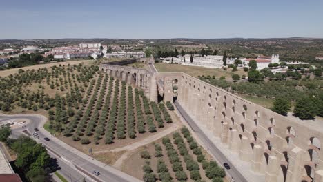 Amoreira-Aqueduct-and-olive-tree-plantations-in-Elvas,-aerial-parallax