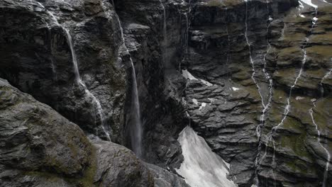 Drone-reveal-waterfalls-from-high-located-glacier-in-Southern-Alps