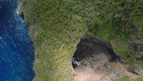 Aerial-top-shot-cliff-and-shore-in-Cabo-Cabron-National-park,-Samana,-Dominica