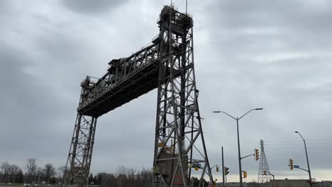 Vertical-lift-bridge-slowly-lowering-back-down-at-the-Welland-Canal-in-Ontario