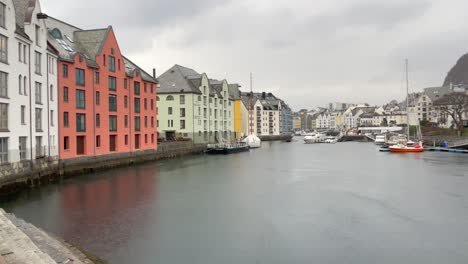 Panning-shot-of-the-famous-city-Alesund-in-Northern-Europe-with-the-architectural-jugendstil-on-a-rainy-day