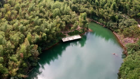 Rising-Drone-Shot-of-Beautiful-Dam-Lake-in-Moganshan,-China