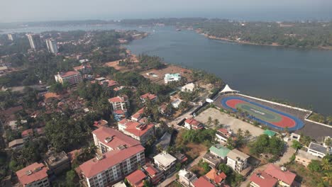 Aerial-footage-of-Mangaluru-city-taken-near-the-skate-park-and-the-Gurupura-River,-also-known-as-the-Pachamagaru-River,-Phalguni-River,-or-Kulur-River