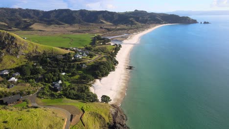 White-sandy-Otama-beach,-Coromandel-Peninsula-coast,-aerial-view-of-New-Zealand-landscape,-sunny-day