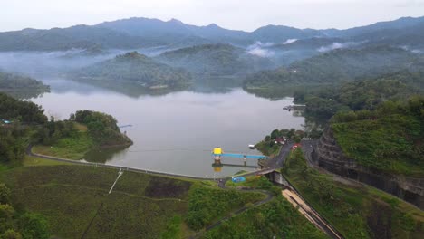 Aerial-view-of-dam-water-gate-on-Sermo-Dam,-Yogyakarta,-Indonesia