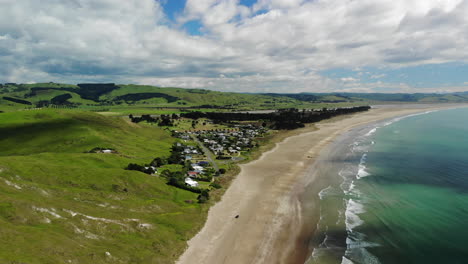 Green-Landscape-At-The-Sandy-Shoreline-Of-Porangahau-Beach-In-Hawke's-Bay-In-New-Zealand