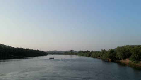 fishing-boat-stand-on-karli-river-water-malvan