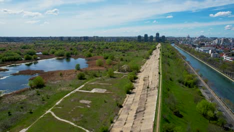 Drone-Side-Movement-Over-The-Dambovita-River-In-Bucharest-Romania,-Vacaresti-Delta