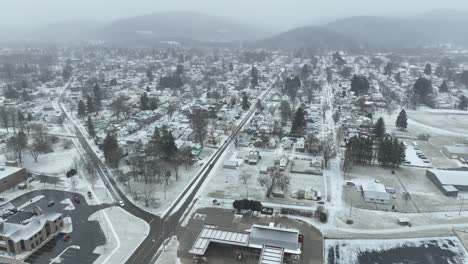 Winter-drone-flight-over-Olean,-NY