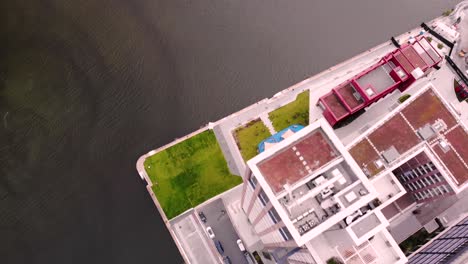 Capital-Dock-aerial-drone-tilt-up-reveal-fly-backward-shot-of-the-tallest-building-in-Dublin-city,-Ireland