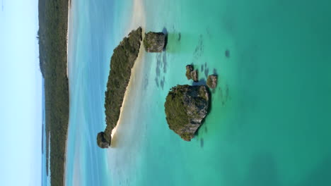 Vertical-aerial-view-over-famous-floating-rocks,-Upi-Bay,-Isle-of-Pines
