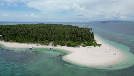 Aerial-parallax-around-banca-outrigger-boat-on-patongong-island-balabac-coastline