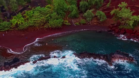 Aerial-drone-shot-from-right-to-left-over-beautiful-Red-Sand-Beach,-Kaihalulu-Beach-in-Maui-Hawaii-at-daytime