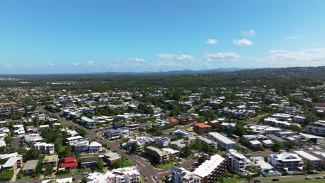 Scenic-Coastal-Town-Aerial-Drone-Flyover-Rooftops-With-Hinterland-View,-4K