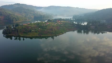 Clouds-And-Nature-Mirror-Reflection-On-Idyllic-Lake-Bunyonyi,-Uganda,-Africa