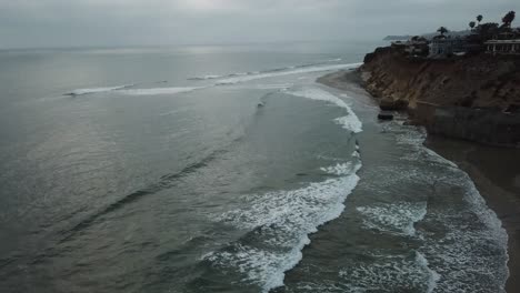 View-from-a-drone-flying-near-the-coast-and-tilting-down-to-the-sea