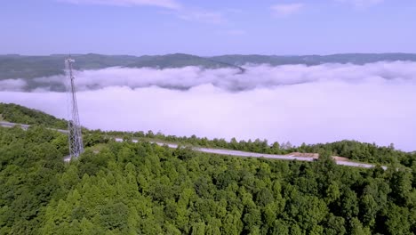 Clouds-and-fog-along-with-traffic-on-Interstate-75-near-Jellico,-Tennessee-in-the-Cumberland-Mountains-with-drone-video-panning-left-to-right