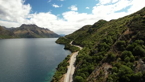 Drone-view-of-scenic-drive-beside-lake