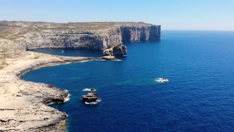Natural-wonder-drone-aerial-pan-forward-shot-birds-view-of-cliffs-in-island-Gozo,-Malta