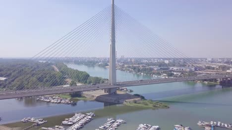 Establishing-4k-shot-of-Ada-bridge-in-Belgrade,-aerial-ascending-summer-day