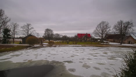 Timelapse-of-rain-falling-on-frozen-ice-lake-defrosting-it-throughout-the-day