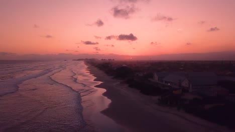 Orange-color-sky-and-ocean-sunset,-aerial-shot,-Brazil