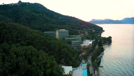 Aerial-view-of-the-Greek-island-of-Corfu's-Mythos-Palace-hotel-complex-next-to-the-beach