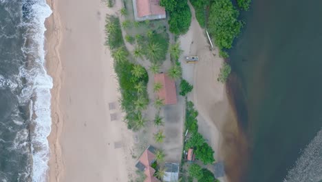 Aerial-Top-Down-Drone-View-of-rural-beach-town-Caraiva-Bahia-Brazil-with-ocean-and-river