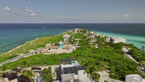 Isla-Mujeres-Mexico-Aerial-v4-drone-flyover-island-towards-southernmost-tip-capturing-popular-ecological-park-Punta-Sur-and-pristine-turquoise-sea-water-in-summer---Shot-with-Mavic-3-Cine---July-2022