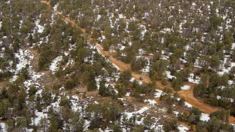 All-terrain-vehicle-off-roading-in-Arizona's-Kaibab-National-Forest---aerial-parallax