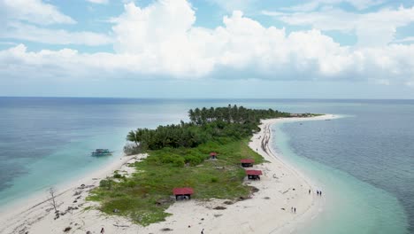 Aerial-pullback-reveals-canimeran-balabac-island-and-tropical-beach-bungalow-hut