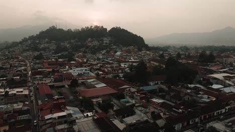 Templo-de-Santa-Lucía-And-Cityscape-Of-San-Cristobal-de-las-Casas-In-Chiapas,-Mexico-At-Sunset---drone-shot
