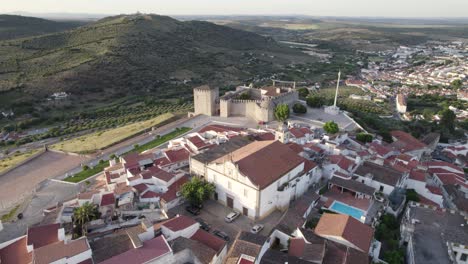 Castle-and-town-of-Elvas-in-Portugal-at-golden-hour,-wide-aerial-pan