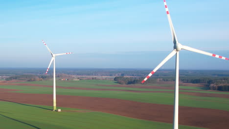 Aerial-panorama-view-of-rural-scenery-with-two-windmills-producing-alternative-energy