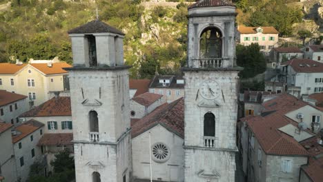 Backwards-drone-dolley-shot-between-the-church-towers-of-the-St-Tryphon-cathedral-in-Kotor