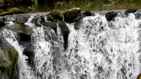 Powerful-Waterfall-Of-Niñodaguia-River-Rushing-Down-From-Rocky-Cliff,-Spain