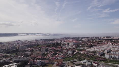 Forward-aerial-flight-to-the-palace-of-ajuda-in-big-city-Lisbon,-Portugal,