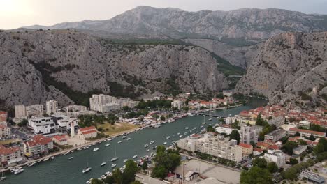Estuary-in-omis,-croatia-where-cetina-River-mouth-meets-the-sea-at-Punta-Beachfront-with-Dinara-mountains-background